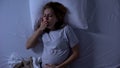 Lady expectant lying in bed feeling nausea, morning sickness, pregnancy health Royalty Free Stock Photo