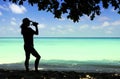 Lady figure with seascape background.