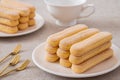 Lady finger biscuits, Italian dessert and sponge cookie on white plate and coffee cup Royalty Free Stock Photo