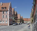 Lady with Flowers walks in Medieval Village in Germany