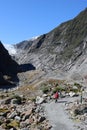Lady on footpath Franz Josef Glacier New Zealand Royalty Free Stock Photo