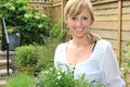 Lady gardener in the garden.. Royalty Free Stock Photo