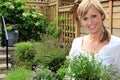 Lady gardener in the garden. Royalty Free Stock Photo