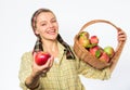 Lady gardener proud of her harvest. Woman gardener rustic style offer you apple on white background selective focus. Try