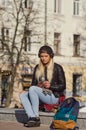 Lady girl happy smiles, sits skateboard Royalty Free Stock Photo