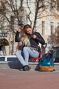 Lady girl happy smiles, sits skateboard Royalty Free Stock Photo