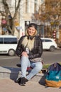 Lady girl happy smiles, sits skateboard Royalty Free Stock Photo