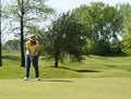 Lady On Golf Putting Green Royalty Free Stock Photo