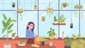 Lady at greenhouse. Cute woman watering plants at home garden, urban tropical jungle crazy hobby houseplant growing care Royalty Free Stock Photo