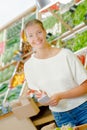 Lady in grocers with list Royalty Free Stock Photo