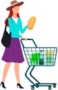 Lady with grocery trolley holding bread. Young woman pushing shopping cart full of products Royalty Free Stock Photo