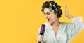 Lady With Hair Curlers Singing Holding Hairbrush Over Yellow Background Royalty Free Stock Photo