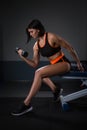 Lady Hand lift up dumbbell one hand at Gym for bodybuilder. in Seated Dumbbell Concentration Curls Action. Halthy concept.