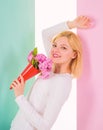 Lady happy received flowers from secret admirer. Woman smiling dreamy try guess who fall in love with her. Girl hold Royalty Free Stock Photo