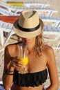 Lady in a hat drinking cocktail, Boracay Island, Philippines Royalty Free Stock Photo