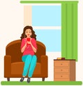 Lady in headpones sitting on couch, listening to music and browsing social media on smartphone Royalty Free Stock Photo