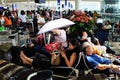 A lady helds an umbrella in Hong Kong airport Royalty Free Stock Photo