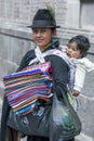 A lady with her child selling textiles at Independence Square in Quito in Ecuador in South America.