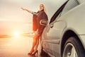Lady in high heel shoes with broked car on the highway