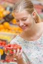 Lady holding punnet strawberries