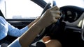 Lady holding steering wheel looking at road to office, careful driver in city Royalty Free Stock Photo