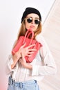 Lady holds pink purse. Girl in sunglasses with serious face Royalty Free Stock Photo