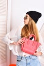 Lady holds pink purse. Woman with fancy female bag. Royalty Free Stock Photo