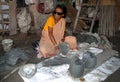 A lady image maker busy in idol making.