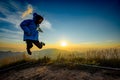 Lady in Jump action with sunset background