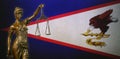 Lady Justice against an American Samoan flag