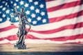 Lady Justice and American flag. Symbol of law and justice with U Royalty Free Stock Photo