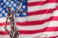 Lady Justice and American flag. Symbol of law and justice with U Royalty Free Stock Photo