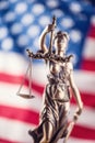 Lady Justice and American flag. Symbol of law and justice with U Royalty Free Stock Photo