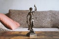 Lady justice or justitia statue on table - landlord and tenant law Royalty Free Stock Photo