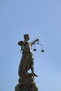 Lady justice at the Roemer in Frankfurt am Main symbolizes Justice with sword and scales