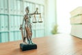 Lady Justice statue in law firm office Royalty Free Stock Photo