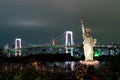 Lady liberty juxtaposed against Rainbow Bridge in Tokyo. Royalty Free Stock Photo