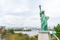 Lady liberty juxtaposed against Rainbow Bridge in Tokyo. Royalty Free Stock Photo