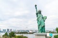 Lady liberty juxtaposed against Rainbow Bridge in Tokyo. Royalty Free Stock Photo