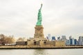 Lady Liberty Statue with Lower Manhattan Modern Buildings and Freedom Tower in Background. New York City, USA Royalty Free Stock Photo