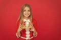 Lady little princess. Girl cute smile hold crown while stand red background. Best award for me. Kid hold golden crown