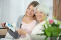 lady looking at magazine with grandmother Royalty Free Stock Photo
