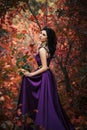 Lady in a luxury lush purple dress Royalty Free Stock Photo