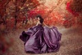 Lady in a luxury lush purple dress Royalty Free Stock Photo