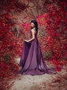 Lady in a luxury lush purple dress