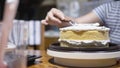 Lady making cream cake