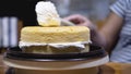 Lady making cream cake