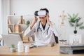 Lady medic looking into virtual glasses in modern office Royalty Free Stock Photo