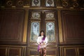 The lady in Middle Thai classical traditional dress suit posing indoor at old railway station building. Royalty Free Stock Photo