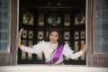 The lady in Middle Thai classical traditional dress suit posing indoor at old railway station building. Royalty Free Stock Photo